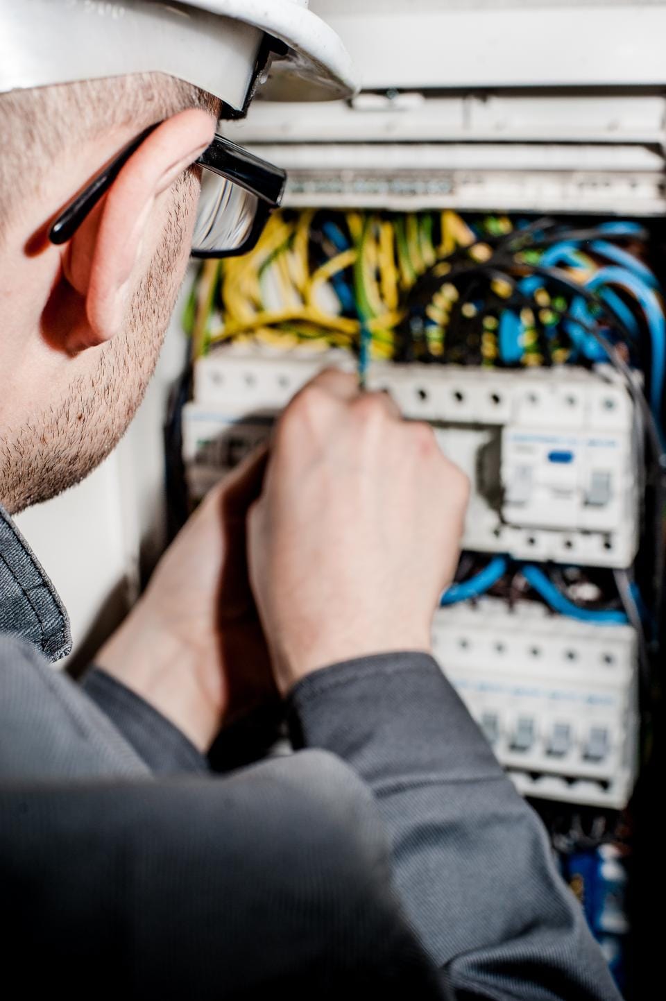 Technician working on an electrical panel